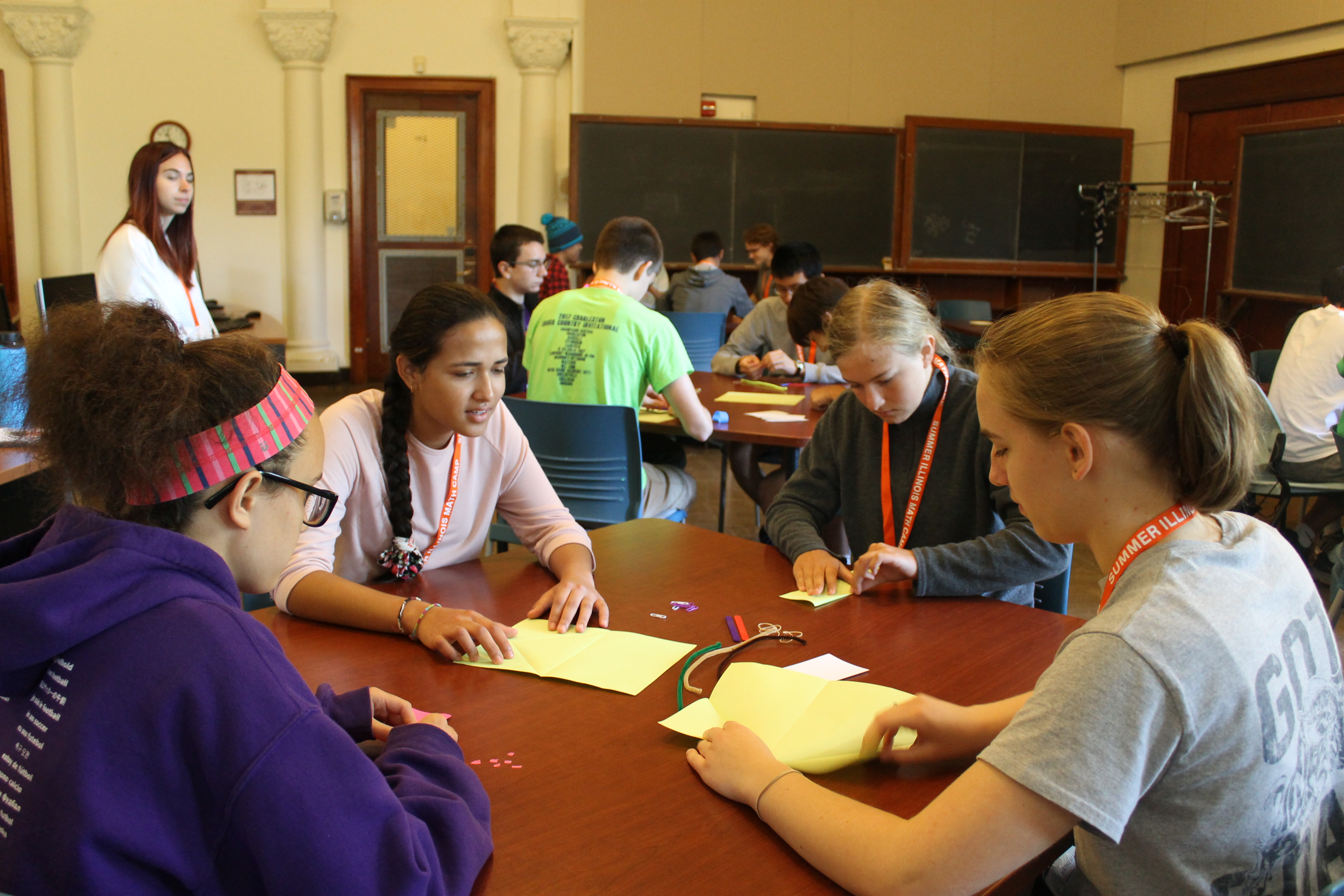 Campers working on a math activity in groups.