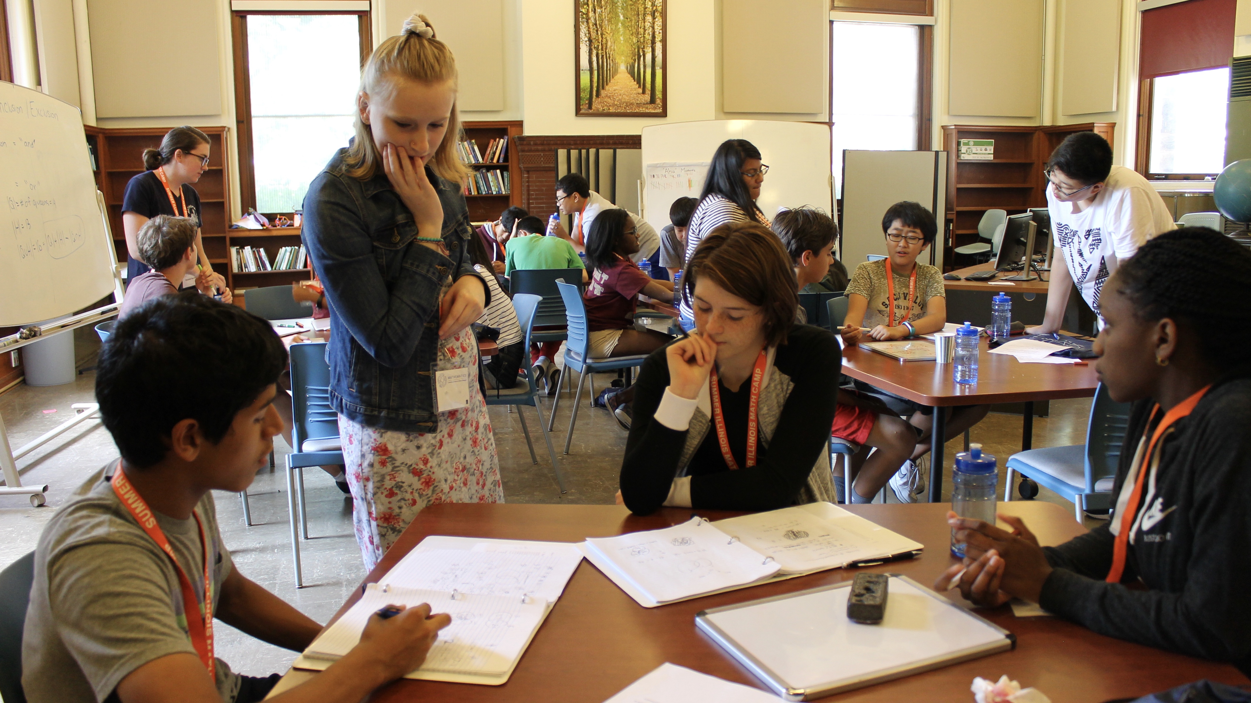 students working in groups with instructors