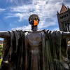 Alma Mater wearing a face covering with Altgeld Hall in the background.